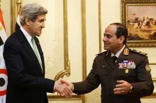 Foto pertemuan antara As-Sisi dan Kerry bulan Maret yang dipakai untuk pertemuan bulan November. Apakah mereka benar bertemu?