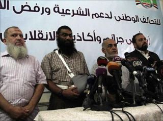 Tokoh-tokoh Koalisi Nasional Pendukung Legalitas Presiden Mursi dalam sebuah konferensi pers (arsip aljazeera)
