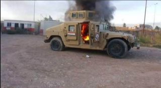 Kendaraan militer terbakar di Mosul (Memo Islam)