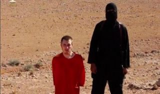 Peter Kassig dan personil ISIS (aljazeera)