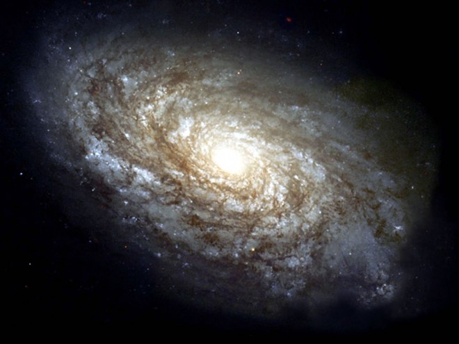 Gambar 2. Galaksi yang terbentuk dari piringan bintang-bintang dan gas-gas pembentuknya. (NASA / solarviews.com)